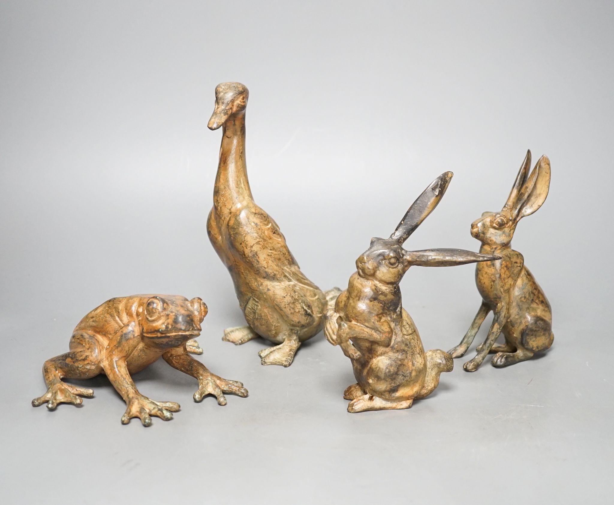 Pierre Chenet Foundry, four small patinated bronzes of a toad, two hares and a duck, largest 19cm high, signed